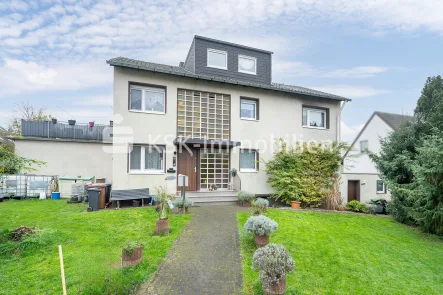 142870 Frontansicht - Haus kaufen in Bergisch Gladbach - Freistehendes Zweifamilienhaus mit Gewerbefläche, Solarthermie und Doppelgarage.