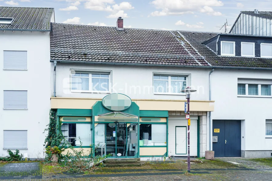 138558 Außenansicht 1 - Haus kaufen in Niederkassel - Wohn- und Geschäftshaus mit Ladenlokal in bester Lage von Niederkassel.