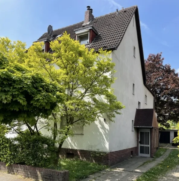 1668719510-Ansicht.png - Haus kaufen in Leverkusen - Mehrparteienhaus mit großem Südgrundstück und 4 Garagen