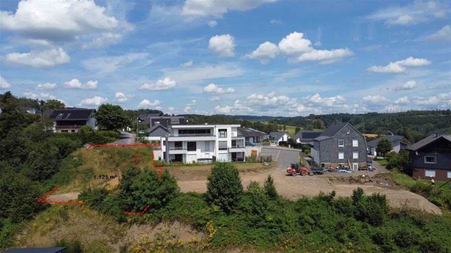 1.125 m² großer Bauplatz mit Fernblick - Grundstück kaufen in Morsbach , Sieg - Baugrundstück mit Panoramablick auf Morsbach und Vorplanung für ein Mehrfamilienhaus!