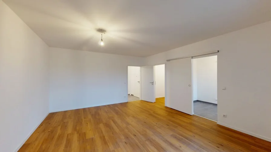 Blick ins Wohnzimmer - Wohnung kaufen in Münster - Bezugsfrei und hochwertig renoviert: Planen Sie jetzt Ihren Einzug!