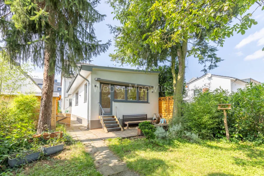 3338 EG Terrasse - Haus kaufen in Köln / Wahnheide - *Reich an Möglichkeiten* Hübsches Haus mit 2 Wohneinheiten, Terrasse, Balkon und großem Garten