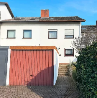 Außenansicht - Haus kaufen in Frankenthal (Pfalz) - Familiengerechtes Reihenmittelhaus mit schönem Grundstück, Garage und Stellplatz in attraktiver Lage