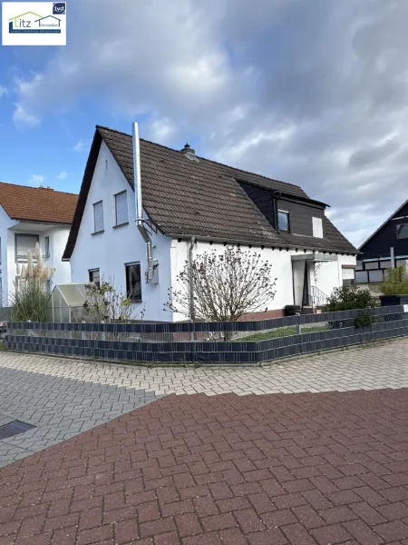 Ansicht von Straße - Haus kaufen in Birkenheide - Gemütliches Einfamilienhaus in schönem Wohngebiet