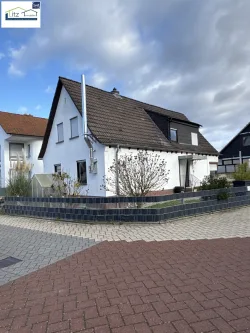 Ansicht von Straße - Haus kaufen in Birkenheide - Gemütliches Einfamilienhaus in schönem Wohngebiet