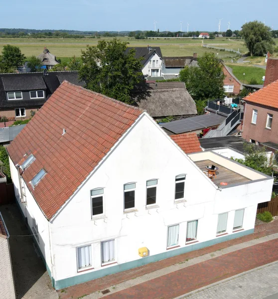 Hausansicht - Haus kaufen in Lemwerder - 3 Familienhaus mit Innenhof und Dachterrasse