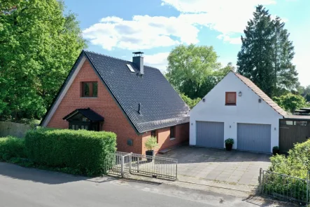 Einfamilienhaus - Haus kaufen in Bremen - Einladendes Einfamilienhaus mit Doppelgarage in Bremen-Lesum.