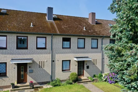 Hausansicht - Haus kaufen in Scheeßel - Geräumiges Reihenmittelhaus unweit des Heidesees