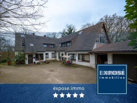 Mehrfamilienhaus mit Doppelgarage - Haus kaufen in Schwanewede - 3 Wohneinheiten mit großem Grundstück in bester Lage von Beckedorf