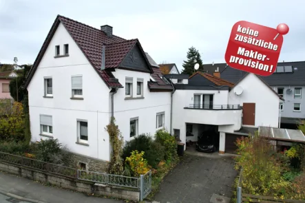 Titelbild - Haus kaufen in Solms - Familienoase mit Stil: Einfamilienhaus mit Garten und Garage - provisionsfrei