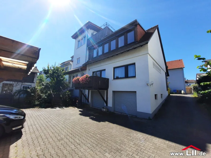 Außenansicht Gartenseite - Wohnung kaufen in Eschborn - Kapitalanlage oder Selbstnutzung zweier Wohnungen in ruhiger Wohngegend von Eschborn