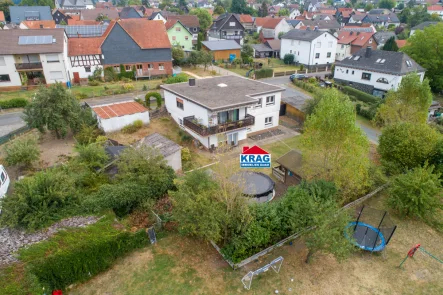 Luftaufnahme - Haus kaufen in Lohra - ++ KRAG Immobilien ++ Familien aufgepasst: bis 5 Kinderzimmer, Balkon, Garten ++