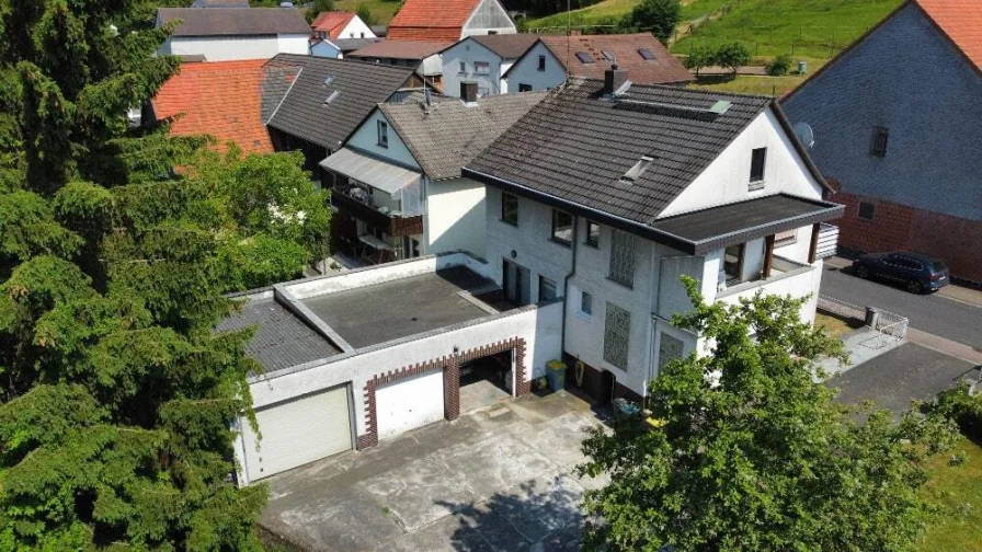 Hinteransicht - Haus kaufen in Grebenau - DIE KOMBINATION AUS ANLAGE UND EIGENNUTZUNG! KEINE KÄUFERPROVISION!