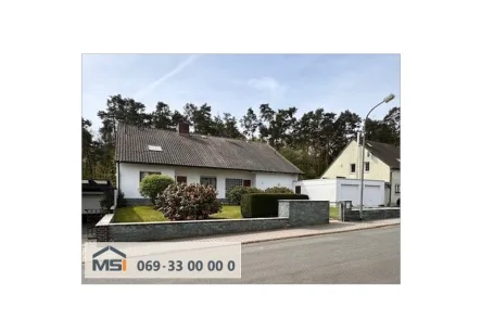 Titelbild - Haus kaufen in Dietzenbach - Gepflegtes Zweifamilienhaus mit Blick ins Grüne in Traumlage von Dietzenbach-Hexenberg