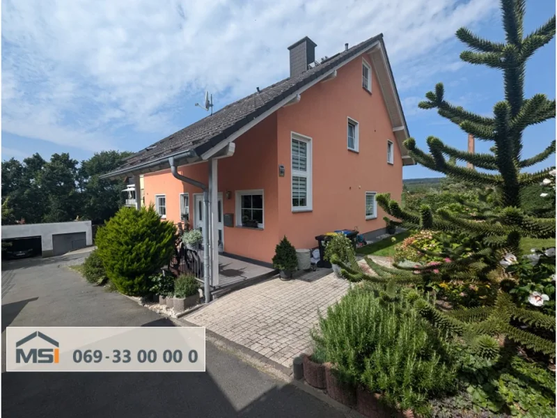 Titelbild - Haus kaufen in Friedrichsdorf - Großzügiges Zuhause mit viel Platz und sonnigem Garten in ruhiger Lage von Friedrichsdorf-Köppern