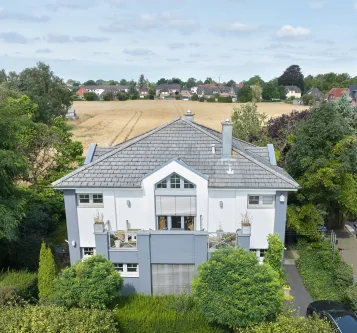 Hausansicht - Wohnung kaufen in Weyhe - Exklusive 3-Zimmer-Wohnung mit klarer Aufteilung und 2 Balkone mit Blick ins Grüne