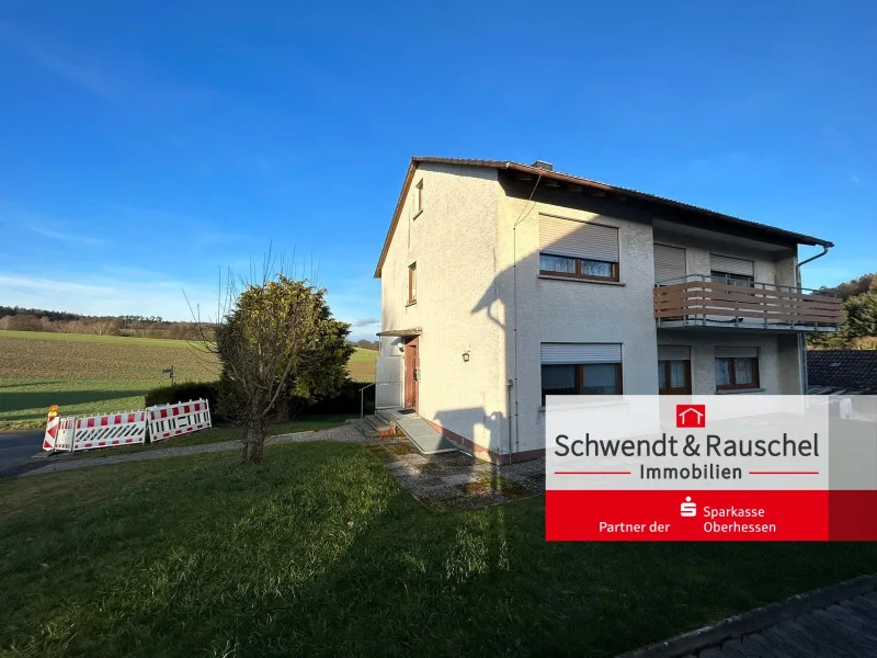 Außenansicht - Haus kaufen in Grebenau - Zweifamilienhaus mit Garten und Garage in Grebenau-Udenhausen