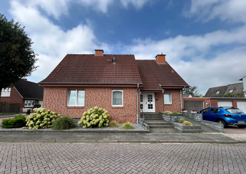  - Haus kaufen in Rheine - Charmantes Einfamilienhaus mit Wintergarten, Teilkeller u. Garage in Rheine-Eschendorf