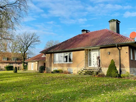  - Haus kaufen in Lüdinghausen - Stilvoller Bungalow in malerischer Lage von Lüdinghausen-Seppenrade!