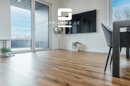 Wohnzimmer - Wohnung kaufen in Oelde - Neubau mit Charme: