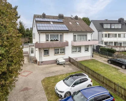 Ansicht - Haus kaufen in Ratingen - Zentral gelegene Doppelhaushälfte mit Ausbaureserve und großem Garten