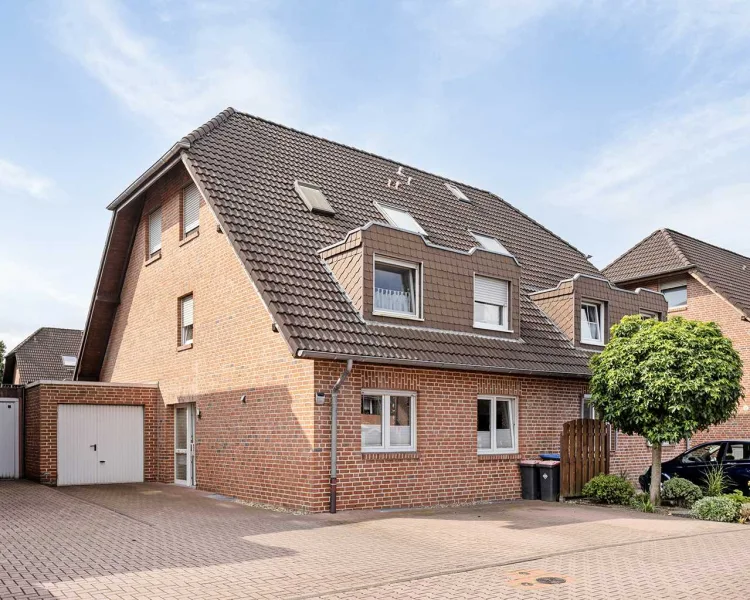  - Wohnung kaufen in Dinslaken - Großzügige Maisonettewohnung mit Garten, Loggia und Garage in Dinslaken