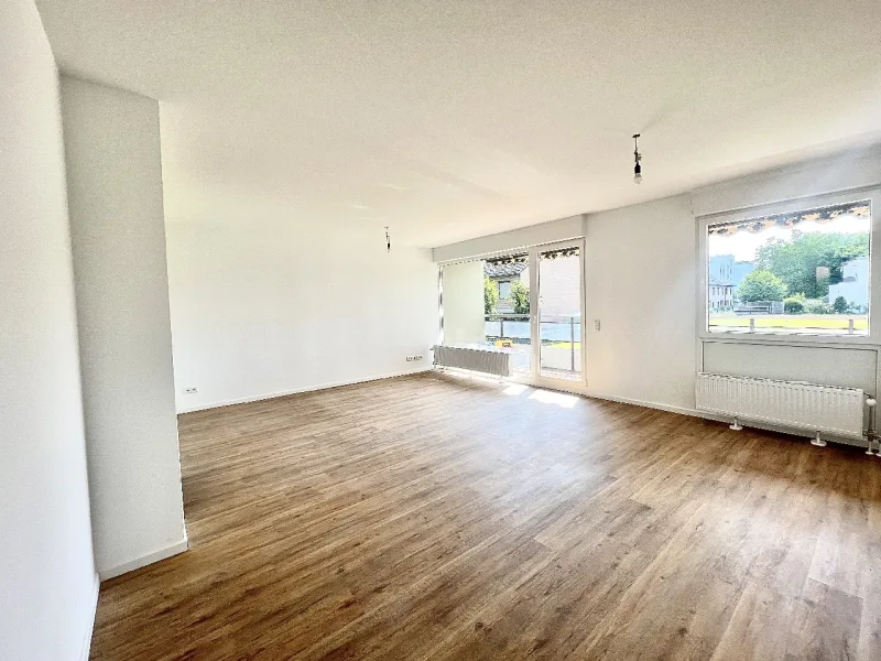 Wohnbereich - Wohnung kaufen in Erkrath - Kernsaniert: 3-Zi.-Wohnung mit TG-Stellplatz in der Nähe des Unterbacher Sees!