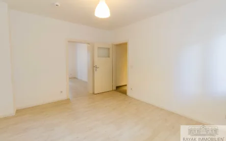 Wohnzimmer - Wohnung kaufen in Düsseldorf Benrath - Moderne 2-Zimmer-Wohnung mit Wintergarten und Stellplatz in Benrath