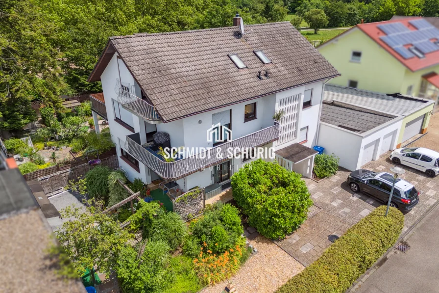 Schmidt & Schurig Immobilien - Haus kaufen in Forst - Teilvermietetes Zweifamilienhaus mit viel Potenzial in Feldrandlage