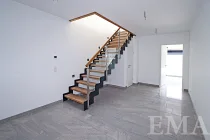 Staircase to the upper floor with stair lighting