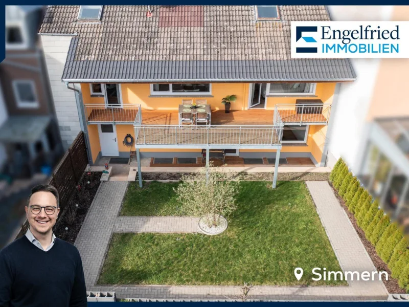 Titelbild - Haus kaufen in Simmern - Modernisiertes Stadthaus mit Einliegerwohnung, Garagen, Garten und Ausbaureserve
