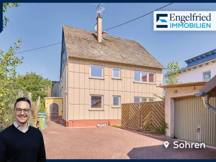 Titelbild - Haus kaufen in Sohren - Flexibles Ein- bis Zweifamilienhaus mit kleinem Garten, altem Wohnhaus, Garage und Ausbaureserven