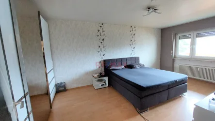 Schlafzimmer - Wohnung kaufen in Groß-Gerau / Dornheim - Schicke Wohnung mit Balkon und PKW Stellplatz!