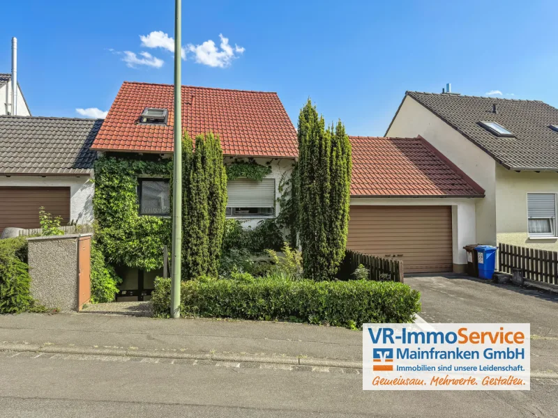 Titelbild - Haus kaufen in Würzburg / Versbach - Lebensqualität auf allen Ebenen: Split-Level-Haus in idyllischer Lage