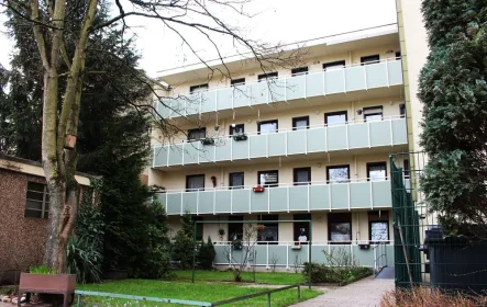 Haus hinten - Wohnung kaufen in Duisburg - Gut aufgeteilte 3-Raumwohnung mit Balkon und Garage in Duisburg-Hochfeld!