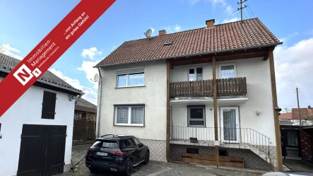 Titelbild - Haus kaufen in Mehlingen - Teilvermietetes Dreifamilienhaus mit Garage und Nebengebäude in ruhiger Lage von Mehlingen