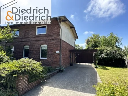  - Haus kaufen in Friedrichskoog - Verkauf einer individuellen Doppelhaushälfte mit Carport und Wiesenblick in Friedrichskoog