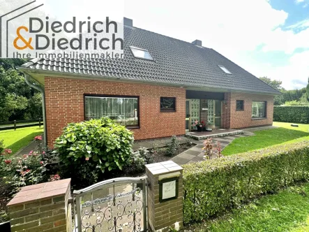 Vorderansicht - Haus kaufen in Tellingstedt - Zweifamilienhauses mit vielen Möglichkeiten und großem Garten in Tellingstedt zu verkaufen