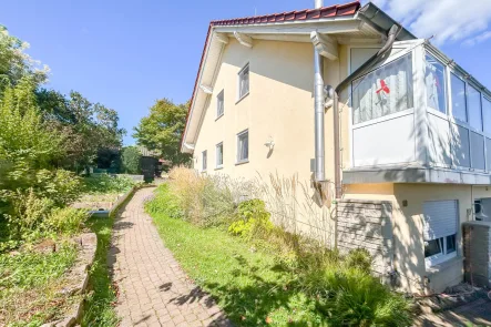 Außenansicht - Haus kaufen in Marktheidenfeld - Wohnoase mit Charme: Einfamilienhaus mit Wintergarten, Garten und Photovoltaikanlage!