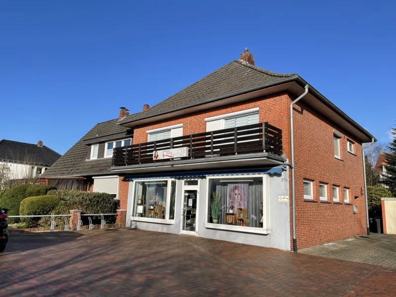 Titelbild - Haus kaufen in Schortens - Wohn- und Geschäftshaus mitten in Heidmühle