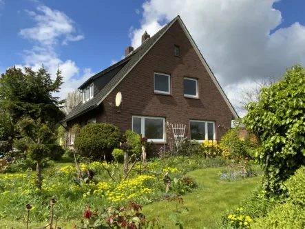 Titelbild - Haus kaufen in Bockhorn Grabstede / Moorwinkelsdamm - Solides Einfamilienhaus im Grünen