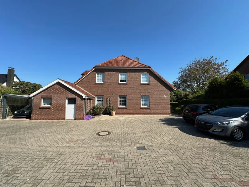 Titelbild - Wohnung kaufen in Schortens - Dachgeschosswohnung mitten in Heidmühle