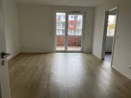 Wohnzimmer mit großem Balkon