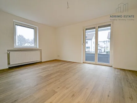 Wohnzimmer - Wohnung mieten in Burgrieden - Moderne 3-Zimmer-Wohnung mit Terrasse und Stellplätzen - Erstbezug nach Sanierung