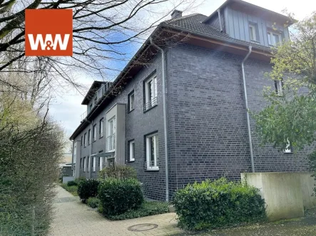 Hausansicht Seite - Wohnung kaufen in Mülheim an der Ruhr - Modernes Wohn-Paradies mit eigener Terrasse in ruhiger Stadtnähe