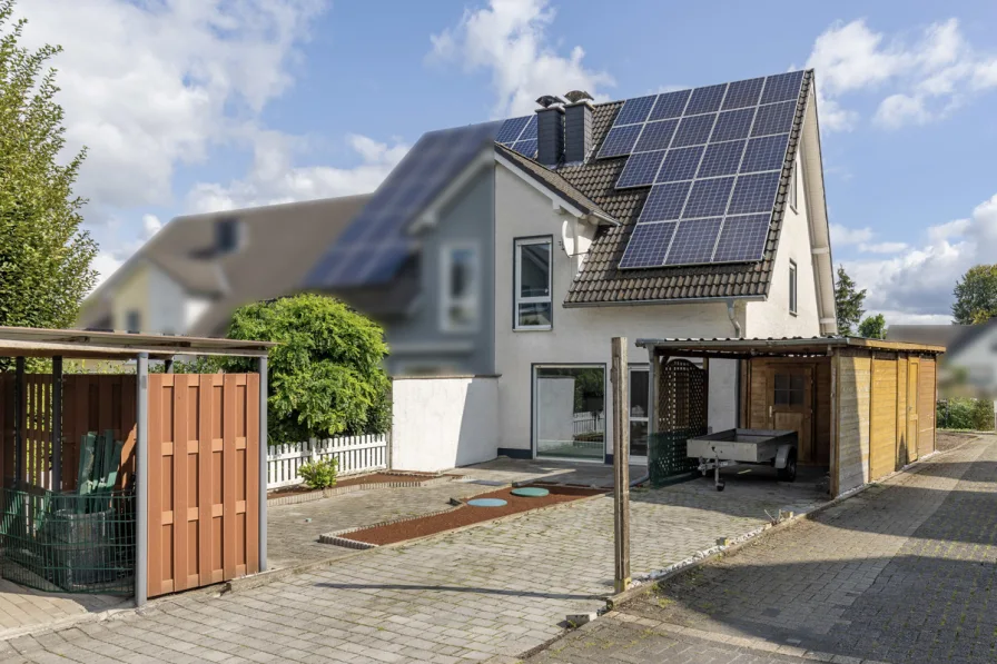 Hausansicht - Haus kaufen in Unna - Doppelhaushälfte in Unna-Mühlhausen – Perfekt für die kleine Familie