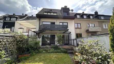 Rückseite - Wohnung kaufen in Köln / Dellbrück - Gemütliche Gartenwohnung in ruhigem Mehrfamilienhaus