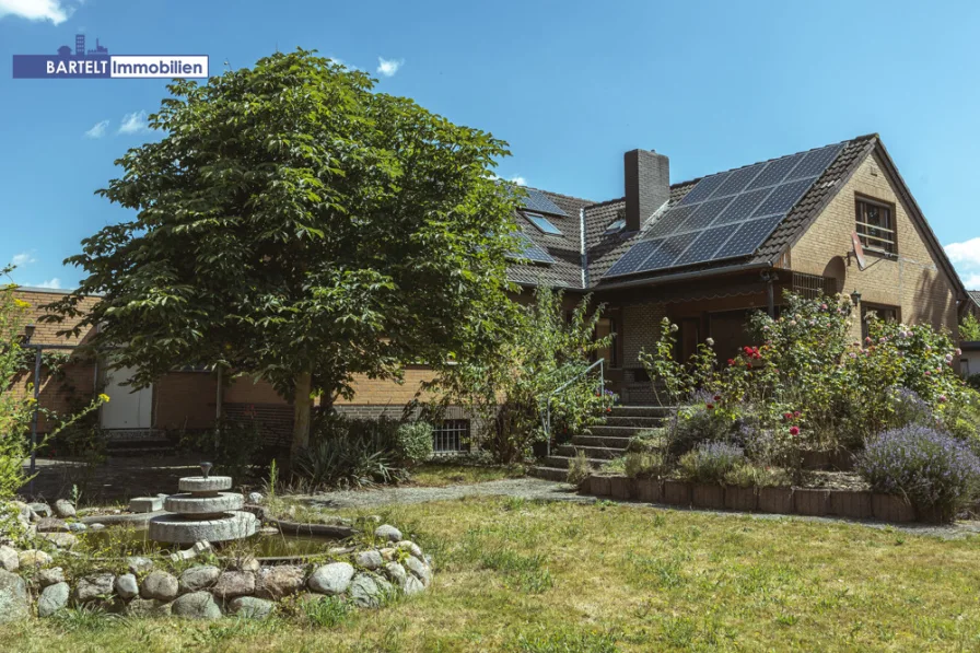 Hauptansicht - Haus kaufen in Lehrte / Sievershausen - Waldnähe inklusive: Ihr Familientraum mit großem Garten!