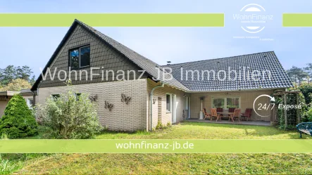 Titelbild Immobilien Hagebutte - Haus kaufen in Gifhorn - Familienfreundliches Ein- oder auch Zweifamilienhaus - mit großem Garten, Sauna, Kamin und 2 Garagen