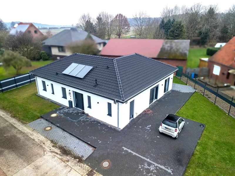 Luftaufnahme  - Haus kaufen in Schiffdorf / Wehden - Schiffdorf-Wehden//Moderner Winkel-Bungalow in ruhiger Lage